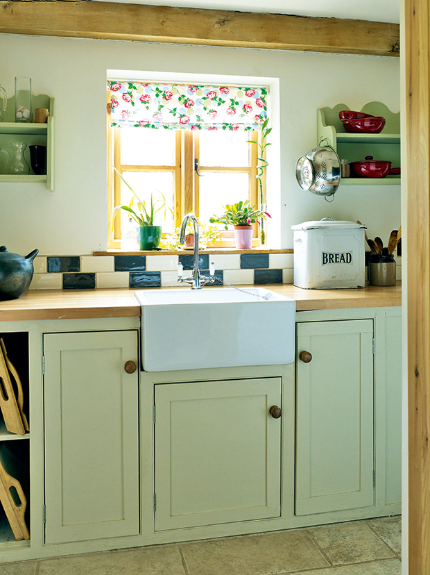 Country style utility with butler sink in an oak frame home