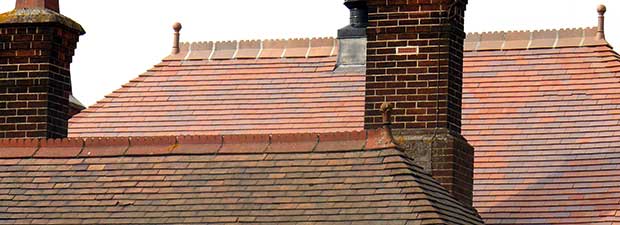 Old and new roof tiles sitting together with tiles from Dreadnought in new brown antique