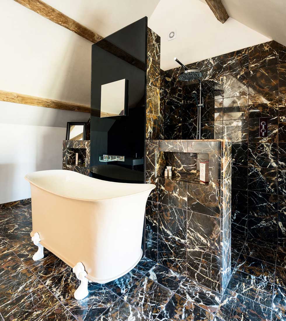 Calw-foot bath in the marble-tiled bathroom