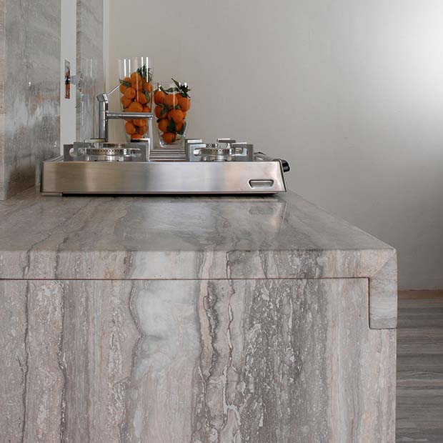Silver Vein polished worktop with travertine work surface
