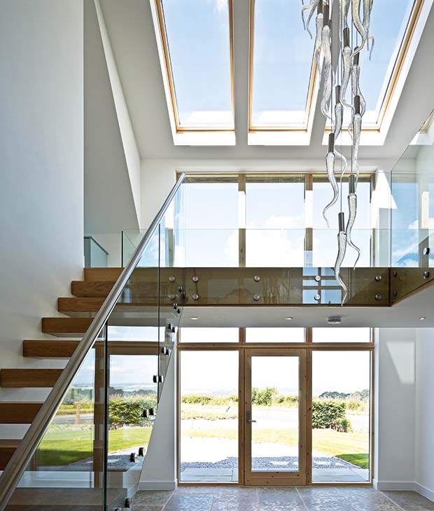 double height hallway atrium with light fitting with 33 hand-blown glass icicle