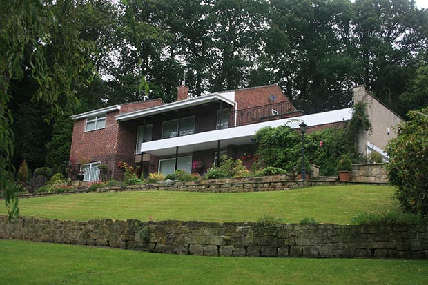 the 1960s hunting lodge style home before it was converted