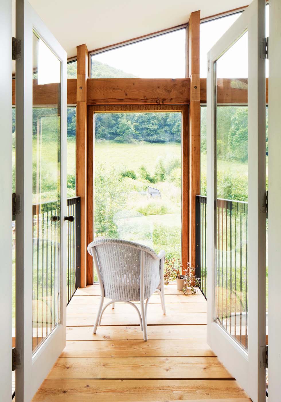 Upstairs, a walkway leads from the master bedroom and bridges the double-height space