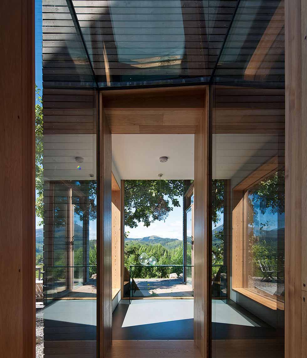 Glass corridors connect the old famrhouse to the new extensions