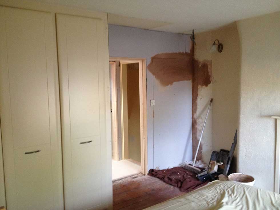 old doorway blocked up and wardrobes moved