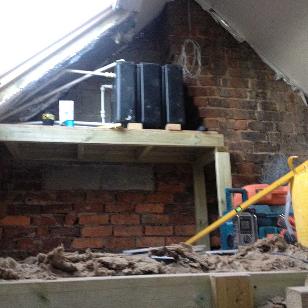 a raised water tank in a Victorian terrace loft
