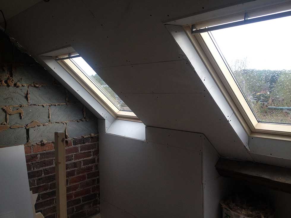 two roof lights and plasterboard room