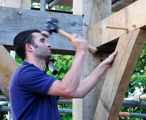 Joe Shimbart tapping in the final oak pegs