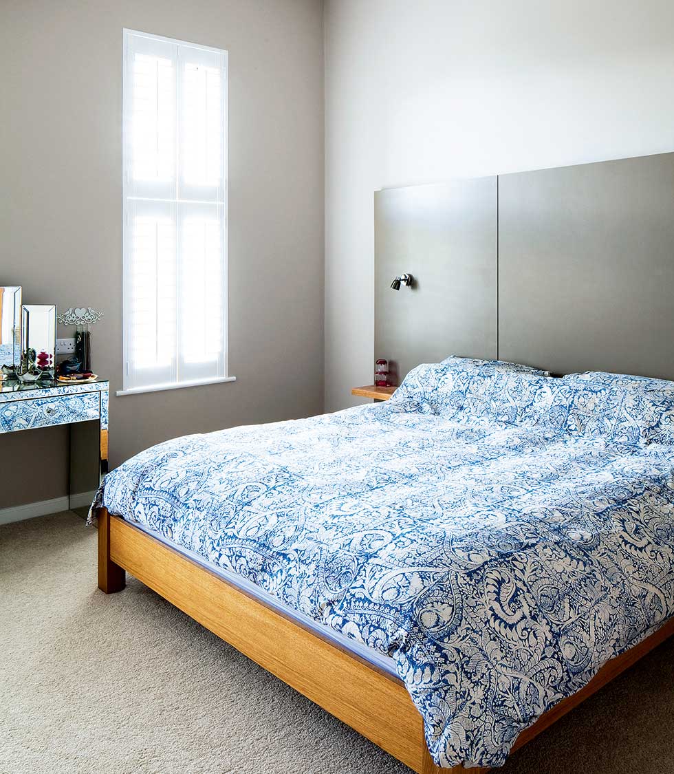 Narrow windows bring in natural light but also offer privacy