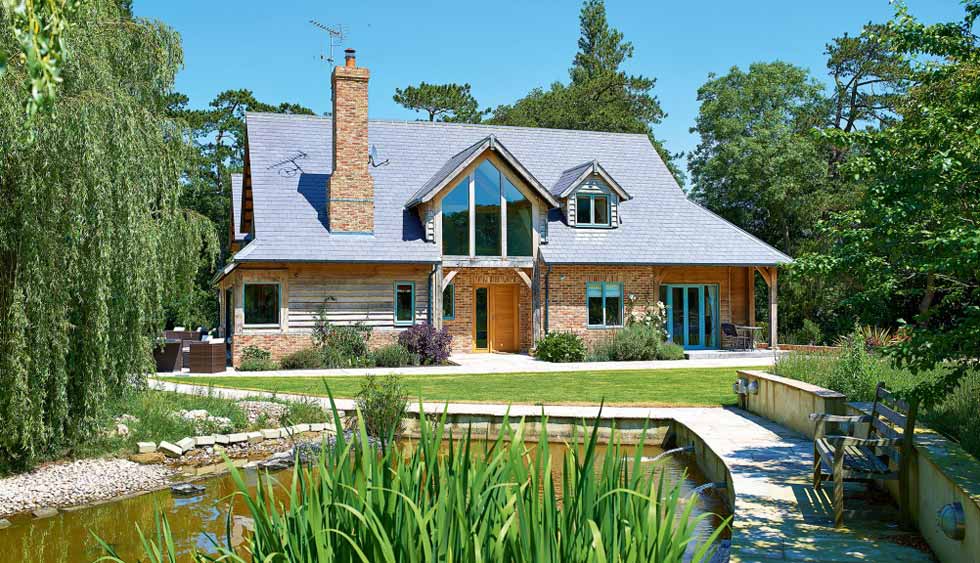 Oak frame home with a flared and extended roofline