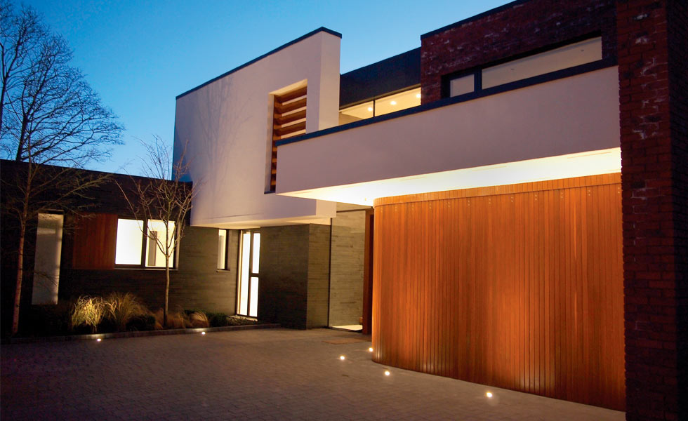 sliding curved garage door at night