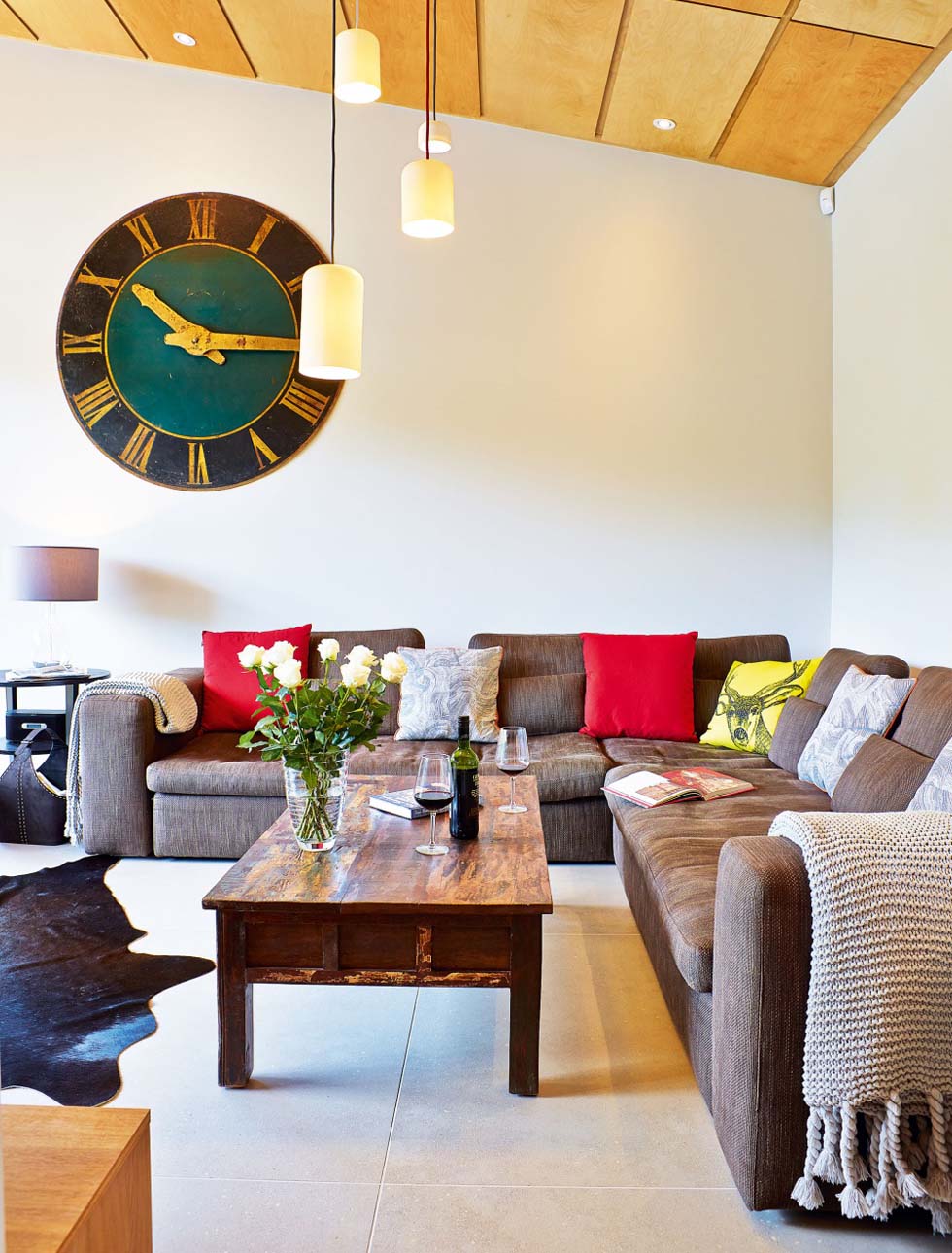Birch-faced plywood tiles have been fitted to the vaulted ceiling and bring warmth to the interiors