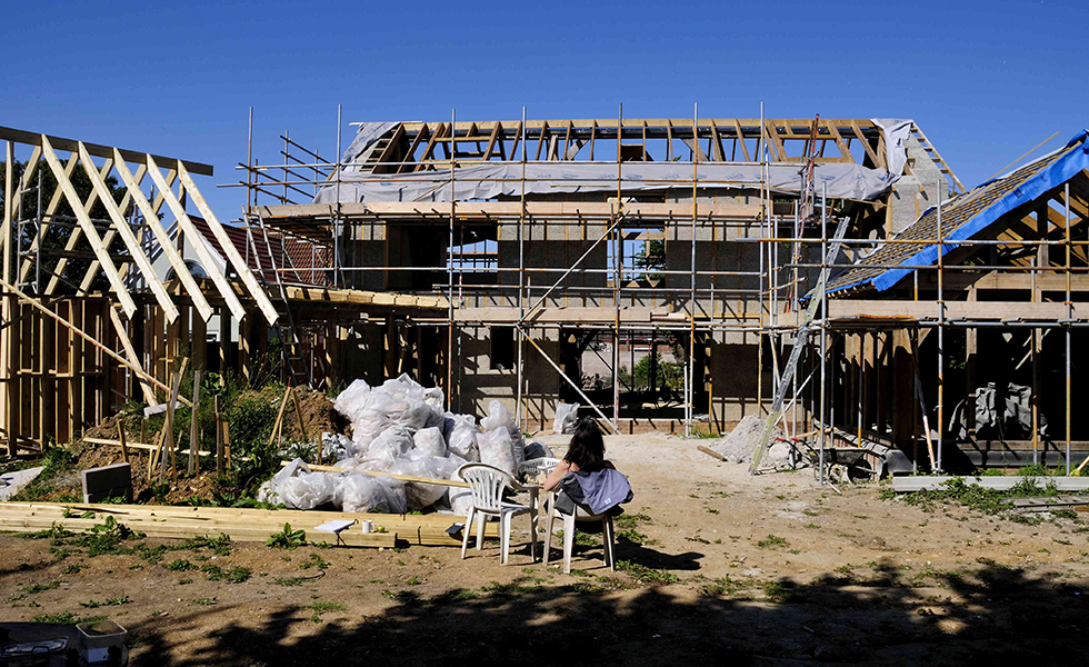 south view of the oak frame home with scaffolding