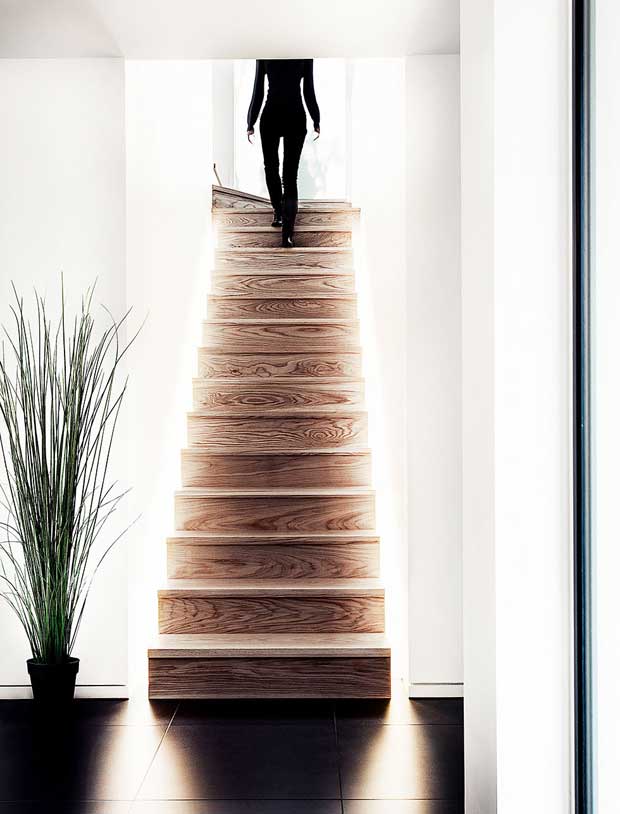 American white oak feature staircase with frosted glass window at the top