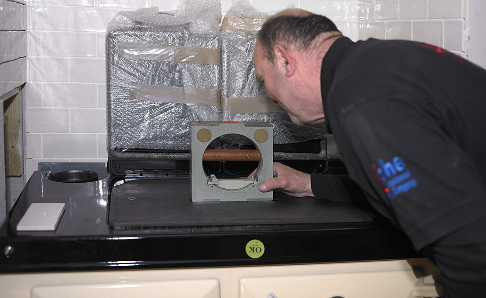 checking the level of the rayburn range cooker