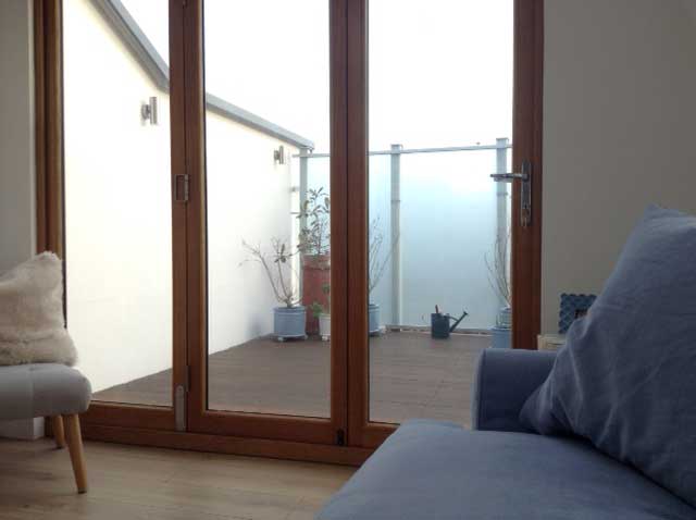 china blue loaf sofa in loft with roof terrace