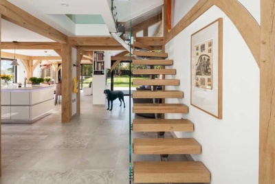 wood and glass staircase in timber frame home