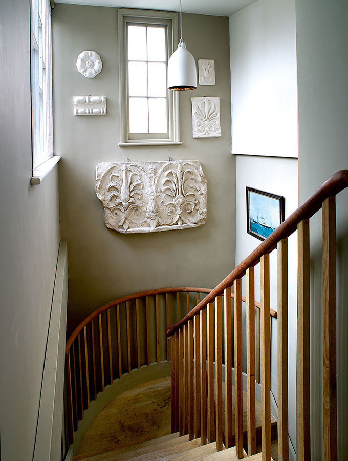 walnut staircase with off-white walls