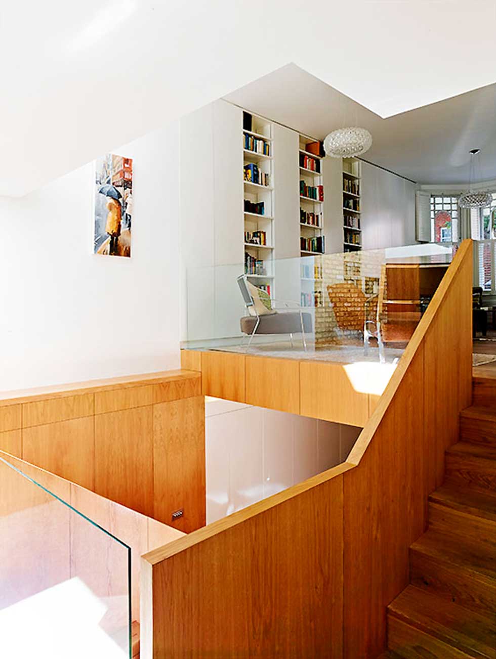 wood and white wall stairs and light well in an Edwardian extension and remodel