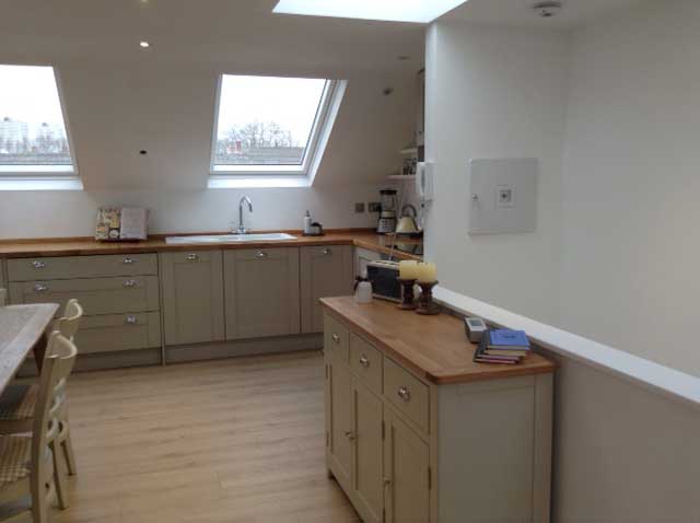 kitchen diner with skylight and wooden worktops