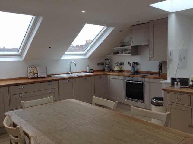 kitchen in loft conversion with mushroom grey cabinets