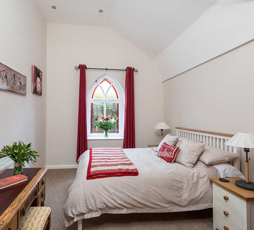 Tin Chapel renovation red bedroom