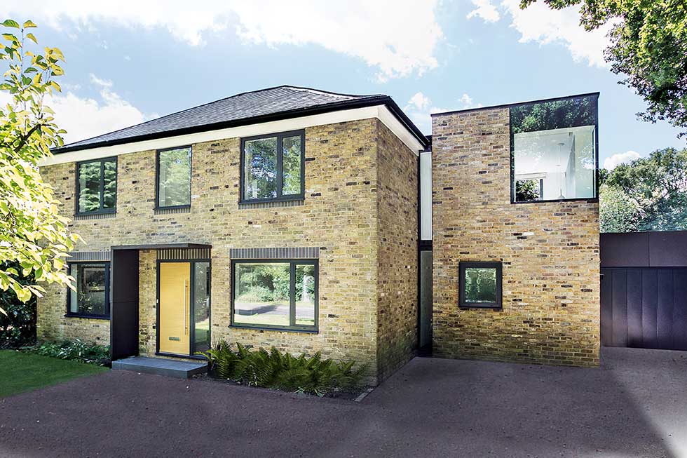 front exterior modern home with tower extension