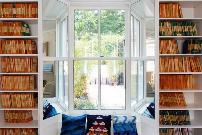 Built in bookshelves to sides of window seat