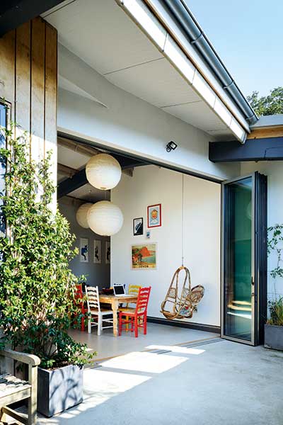 outdoor indoor space with bi-fold doors to courtyard garden