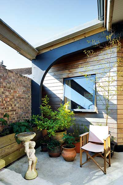 courtyard garden to timber clad youth club home