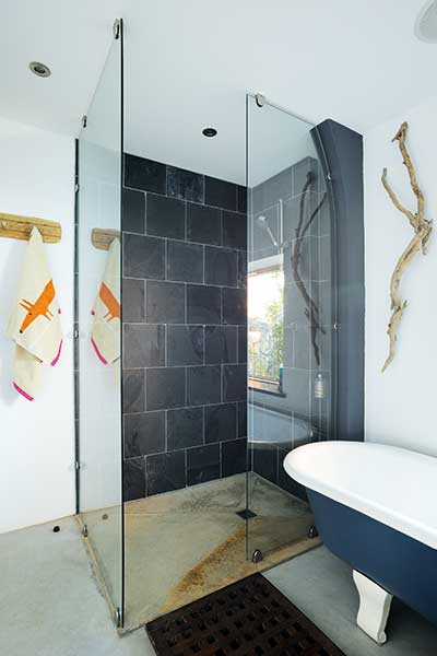 walk in shower with slate tiles