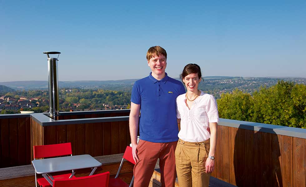 Tom and Emily Hunt on the roof top terrace of their self build on a city plot