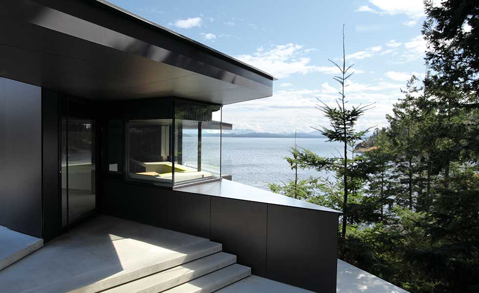 contemporary lakeside home made from modern black material