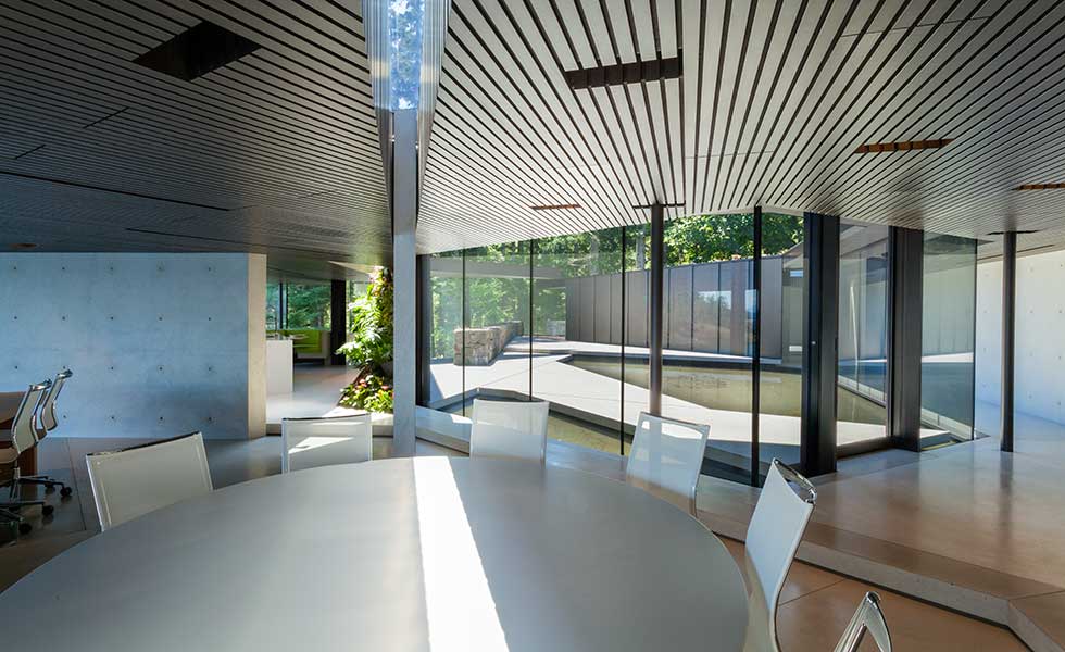 dining room of modern home with large glass panels