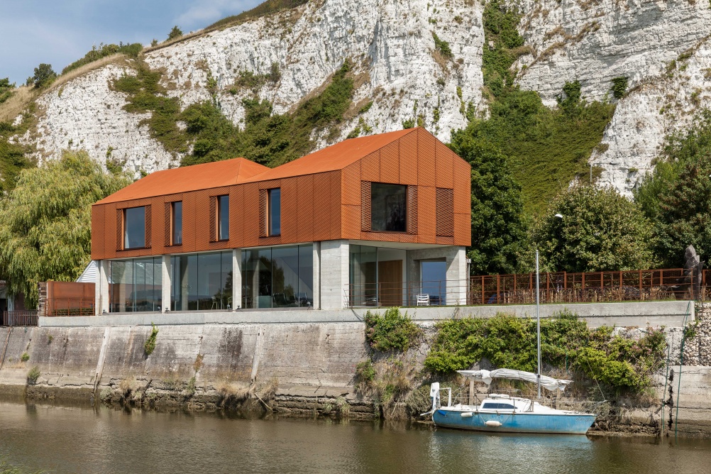 contemporary home on riverside with metal top and glass bottom