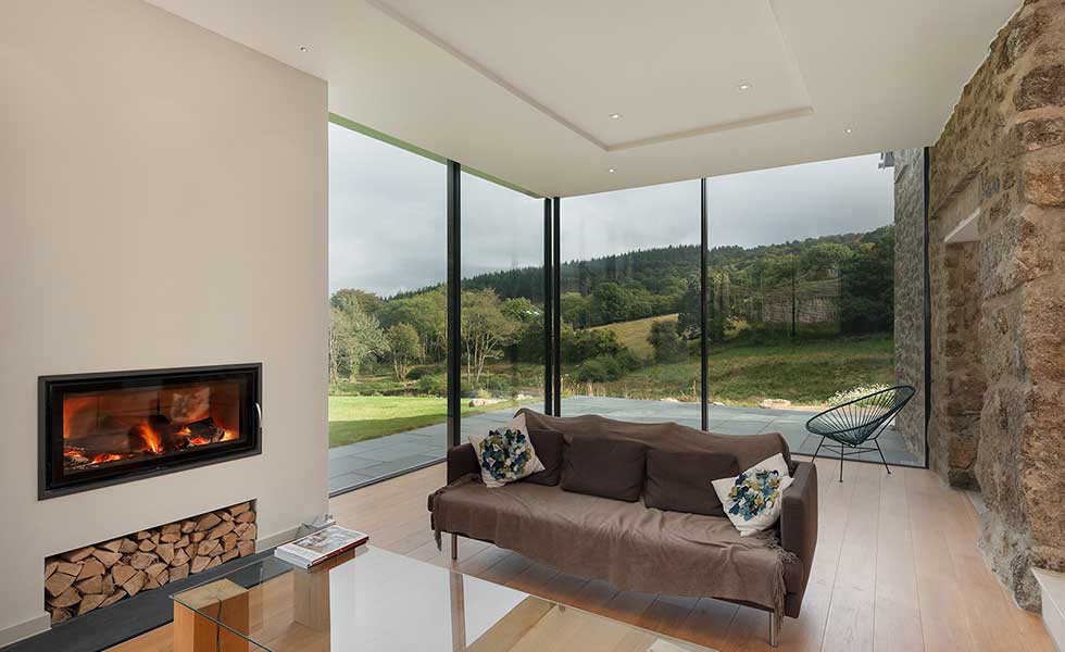 overlooking countryside from glass extension living space