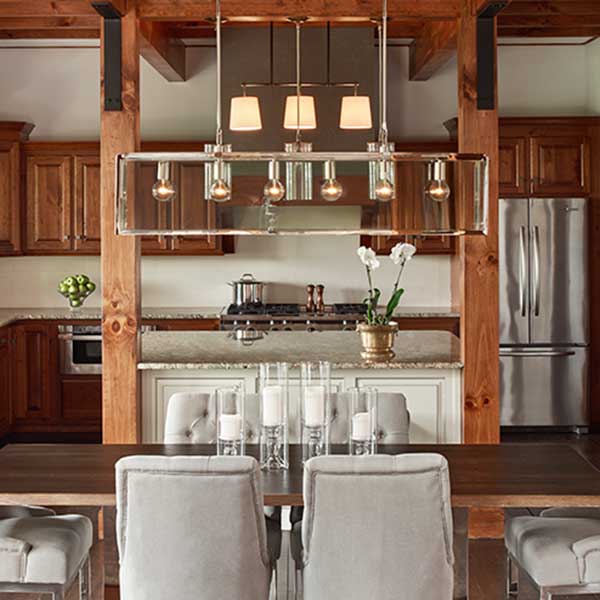 kitchen and dining room space with wooden features and grey dining chairs
