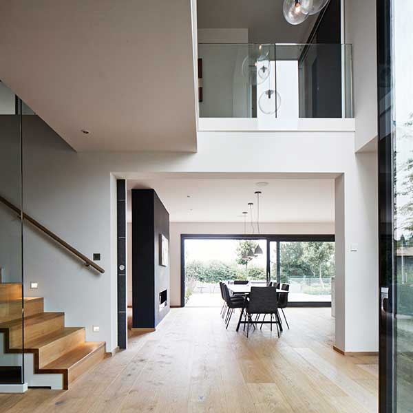 open plan living space with large landing, glass panelling on landing and dining space