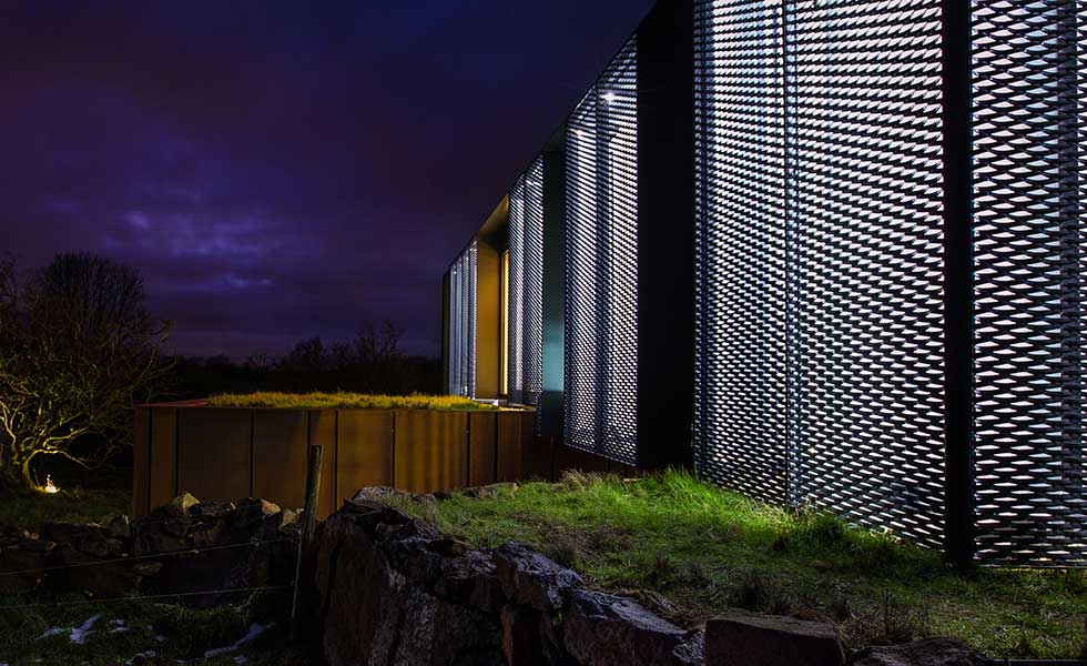 night shot of shipping container home