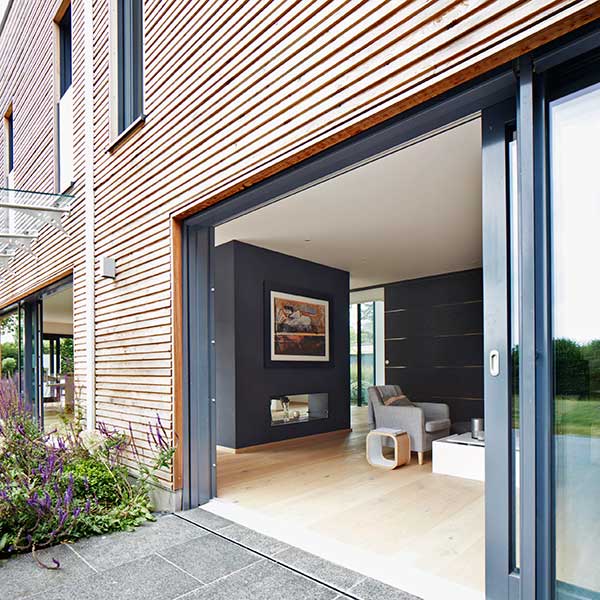 wooden panelled home with glass sliding doors