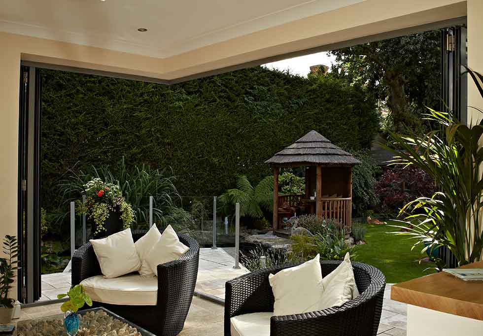 origin open plan living garden rattan chairs cream cushions