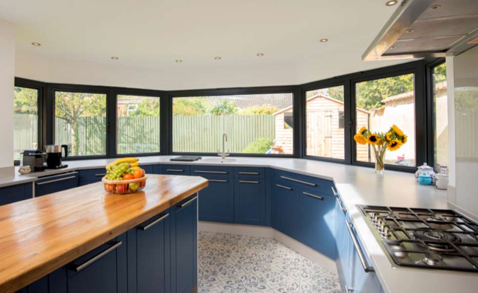 origin blue kitchen cupboards oranges
