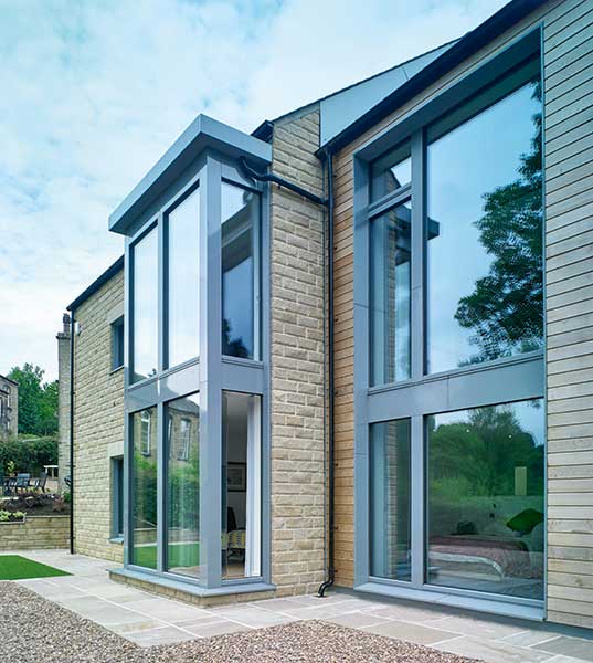 low u value brick and block and stone and timber home