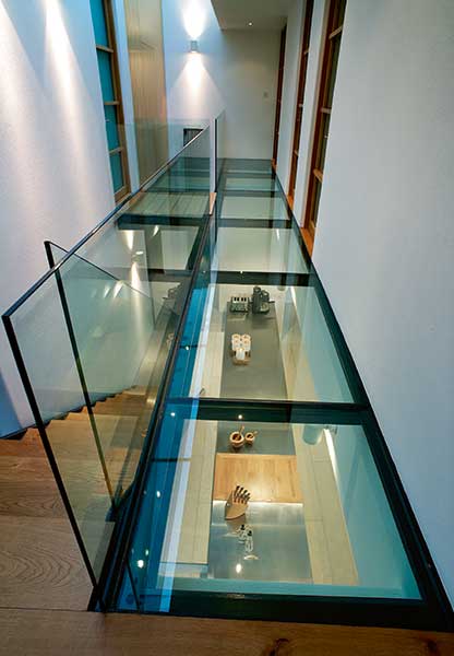 glass floor walkway and ceiling in modern self build