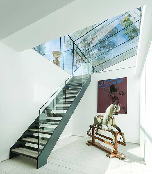 open tread staircase in extended and renovated home