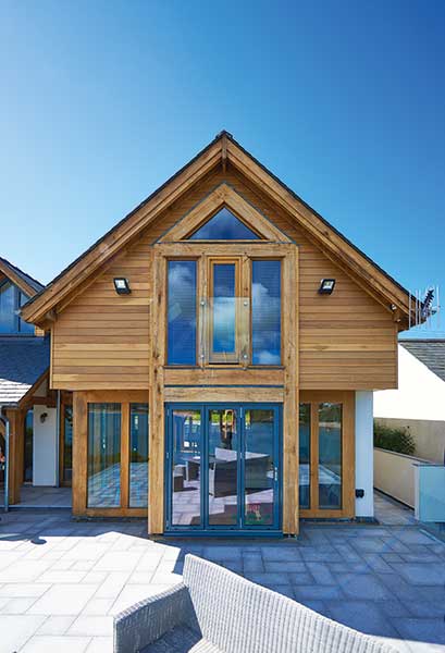 Horizontal timber cladding with aluminium and oak windows and doors