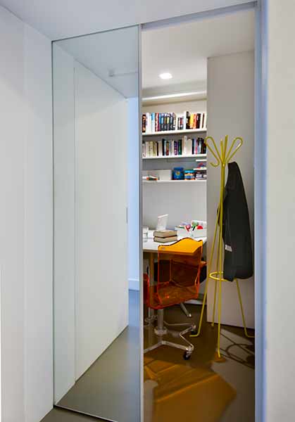 A hidden door reveals a secret office space in this London home