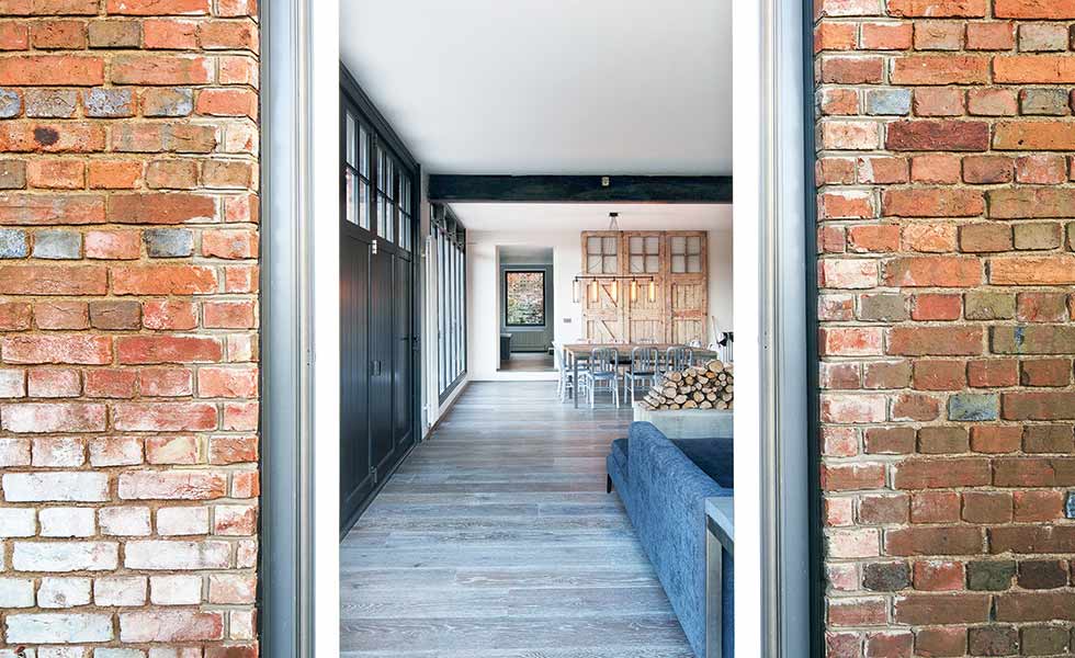 The original station doors act as a focal point on the wall of this amazing conversion