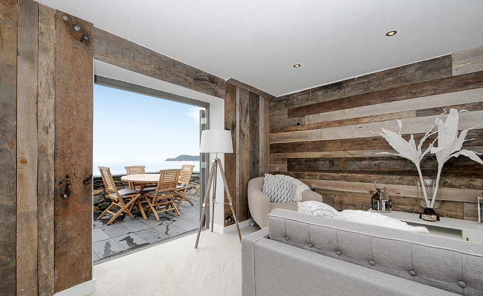 Timber cladding to the internal walls adds texture and warmth to the interiors of this public loo conversion