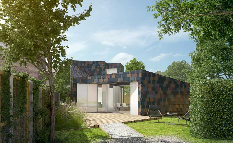New build 2 bedroom retirement property clad in multi-coloured artificial slate.